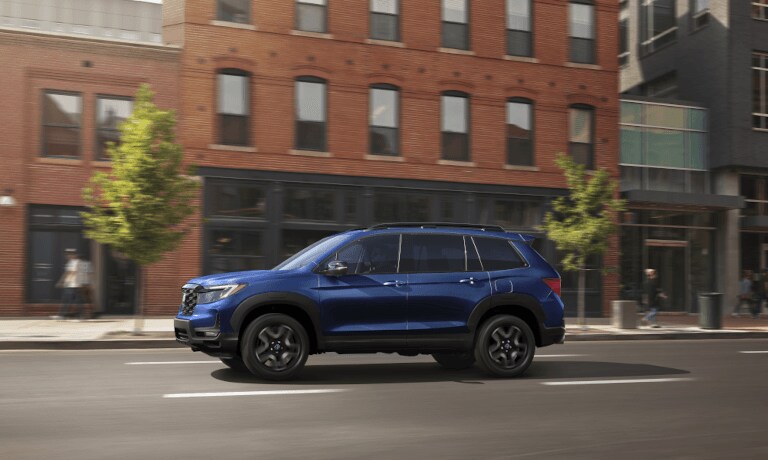 2023 Honda Passport driving through a busy city