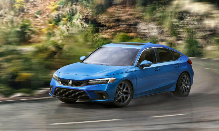 2022 Honda Civic Hatchback exterior driving on a curvy road