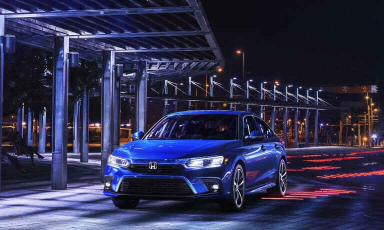 2023 Honda Civic parked under an overhand at night