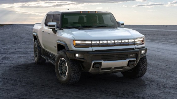 gmc_hummer_ev_exterior_revolutionary_design_stopped_on_dirt_road.jpeg