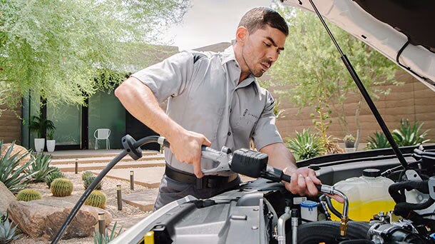 Technician filling oil