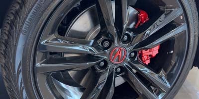 Black wheels and red brake calipers by RIMGUARD