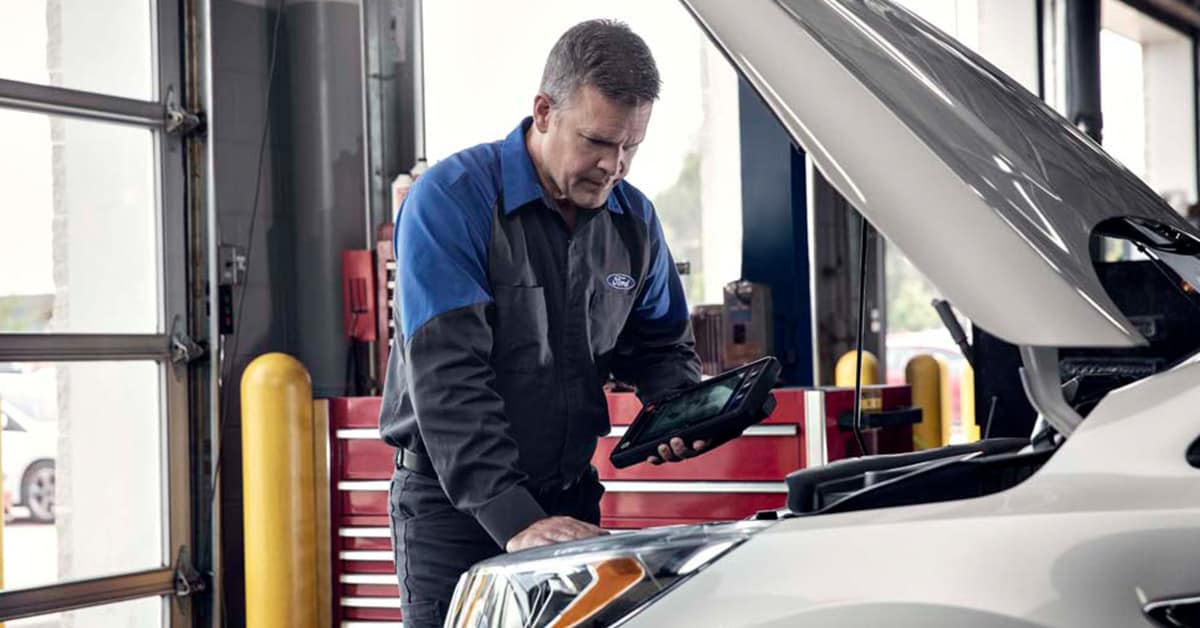 A reliable pre-owned vehicle undergoing inspection at Lester Glenn Ford