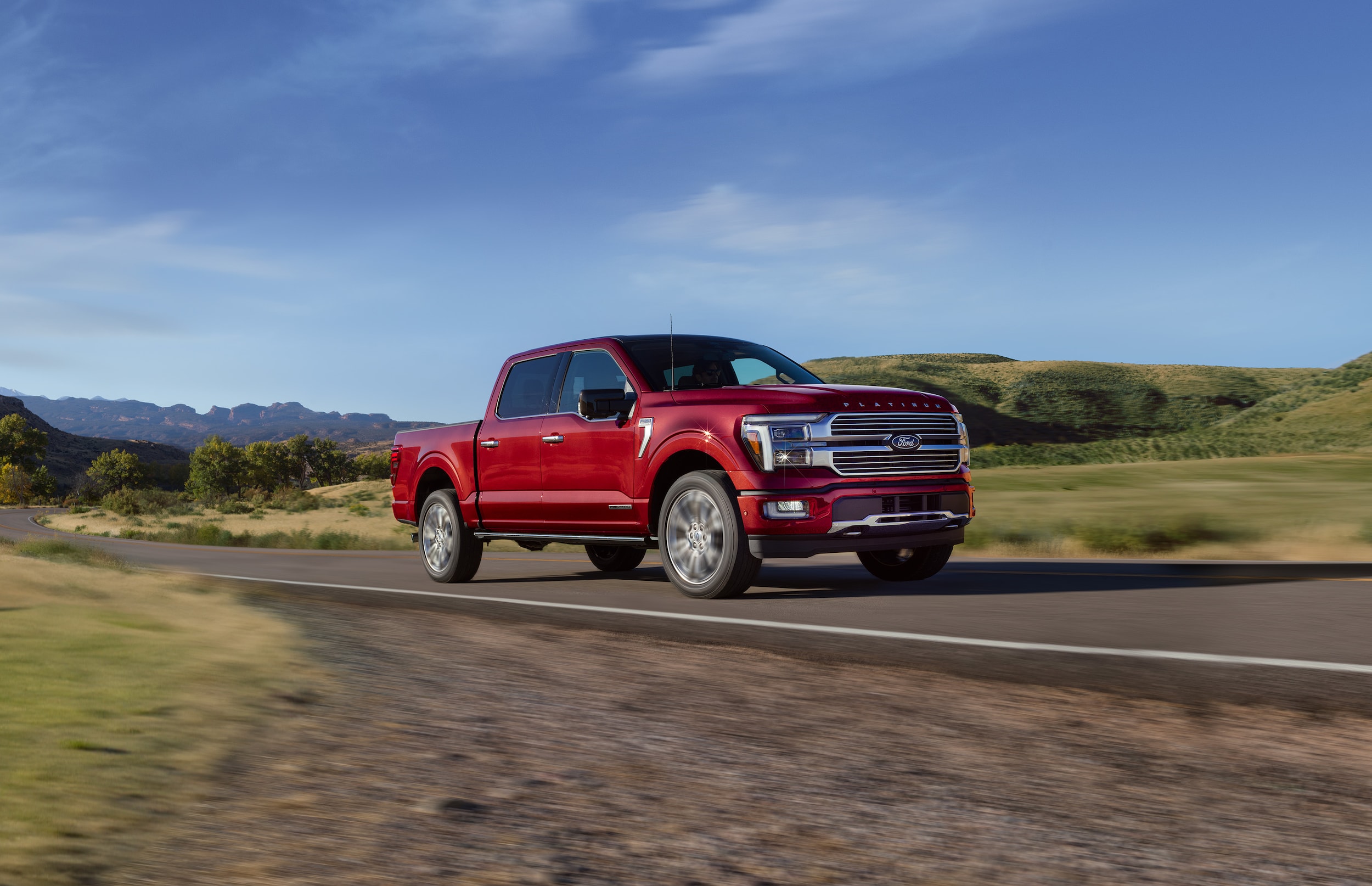 Popular pre-owned 2025 Ford F-150 driving on straight road