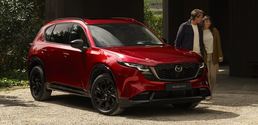 Owners of Mazda SUV happily seeing their new mazda vehicle