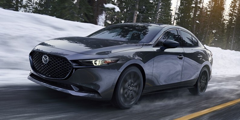 Sporty Mazda3 Sedan driving in cold weather