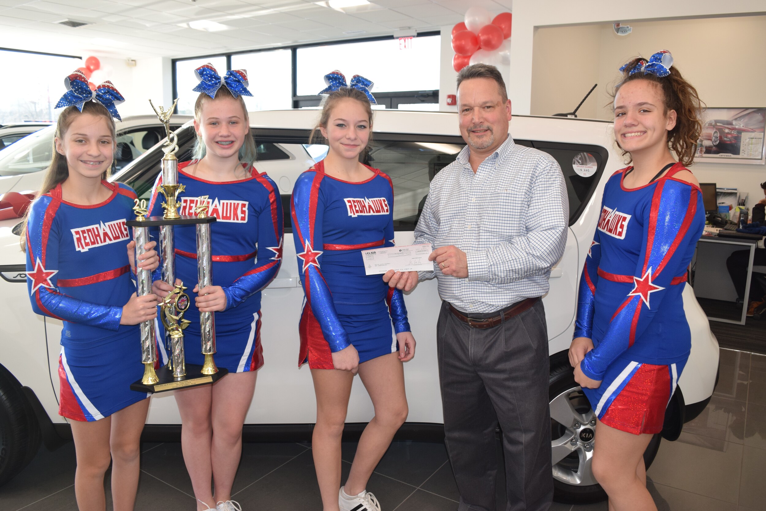 Natick Cheerleaders and Lev Kia.JPG