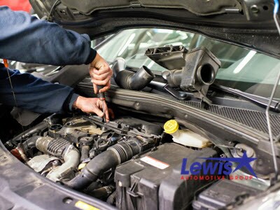 mechanic-working-car-engine-doing-repairs_126745-1451.jpg