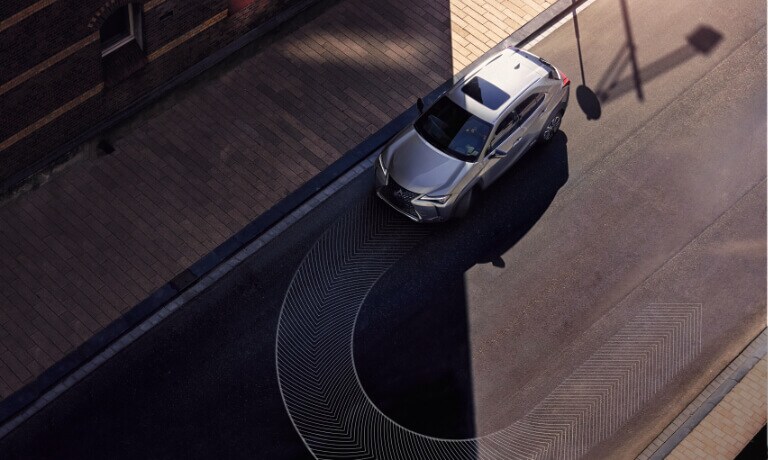 2020 Lexus UX 250h taking u-turn on a street
