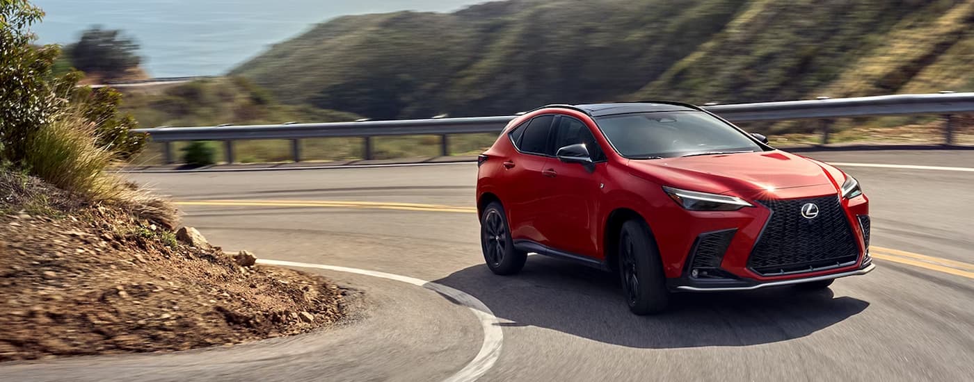 wlp%20-%202026%20Lexus%20NX%20350%20F%20SPORT%20Dealer%20near%20Rock%20Island.jpg A red 2026 Lexus NX 350 F SPORT driving on a corner