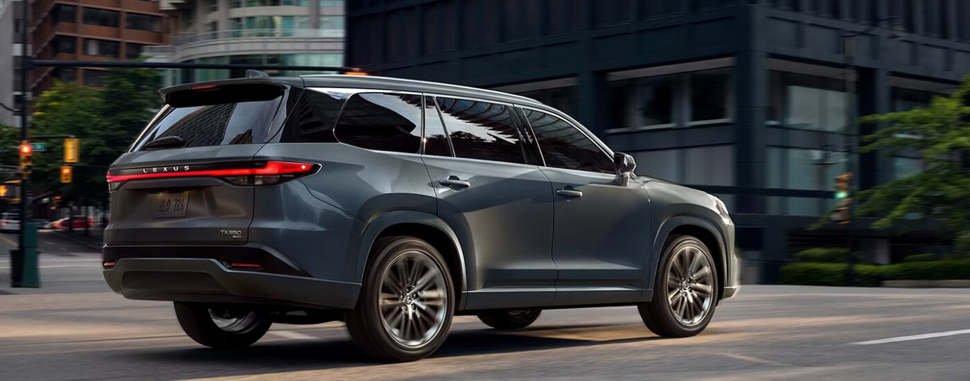 2026%20Lexus%20GX%20-%20stoplight.png Grey 2026 Lexus TX driving through a city