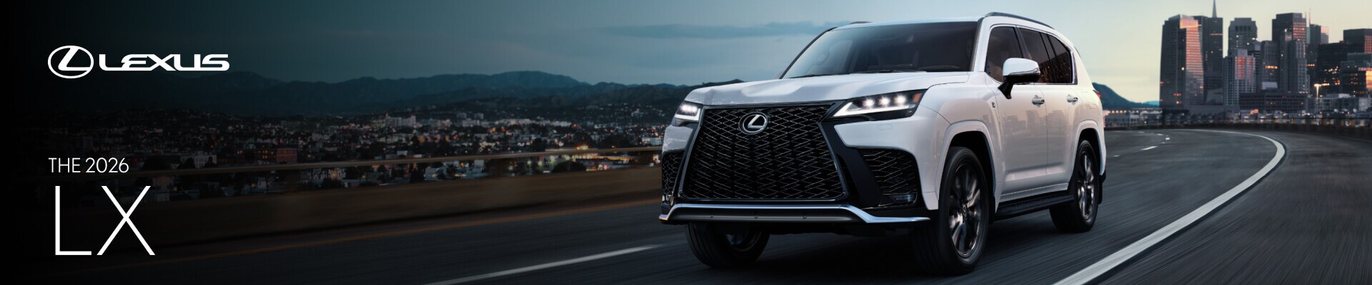 A front action shot of a white 2026 Lexus LX driving on a highway with a city skyline backdrop.