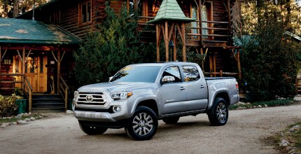 Toyota Tacoma Toyota Tacoma parked in front of cabin
