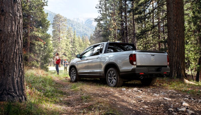 Honda Ridgeline Honda Ridgeline parked in a forest