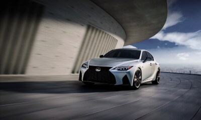 Lexus IS silver Lexus IS driving around a corner