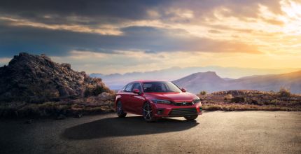 Honda Civic red Honda Civic parked outside in front of mountains and sunset