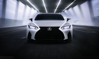 Lexus IS white Lexus IS speeding toward the camera