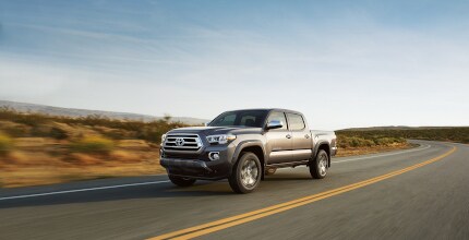 Toyota Tacoma Toyota Tacoma driving around a turn