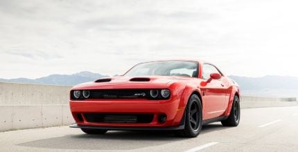 Dodge Challenger orange Dodge Challenger driving outside