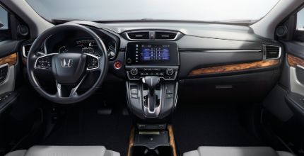 Honda CR-V interior interior of a Honda CR-V showing the front seats, steering wheel, and dashboard