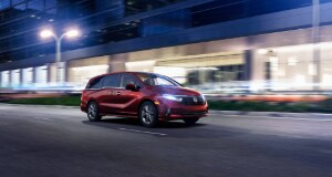 Honda Odyssey Honda Odyssey driving at night with headlights on