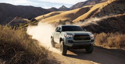 Toyota Tacoma Toyota Tacoma driving on dirt road