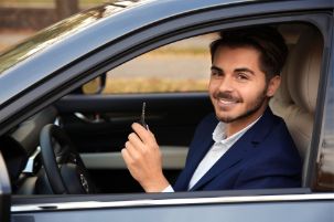 Driver showing the key for their first car.