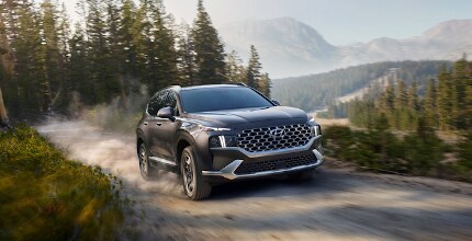 Hyundai Santa Fe Hyundai Santa Fe driving on dirt road