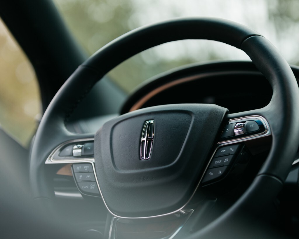 Lincoln of New Bern is a Car Dealership in New Bern near Vanceboro NC | Closeup of black leather wrapped Lincoln steering wheel