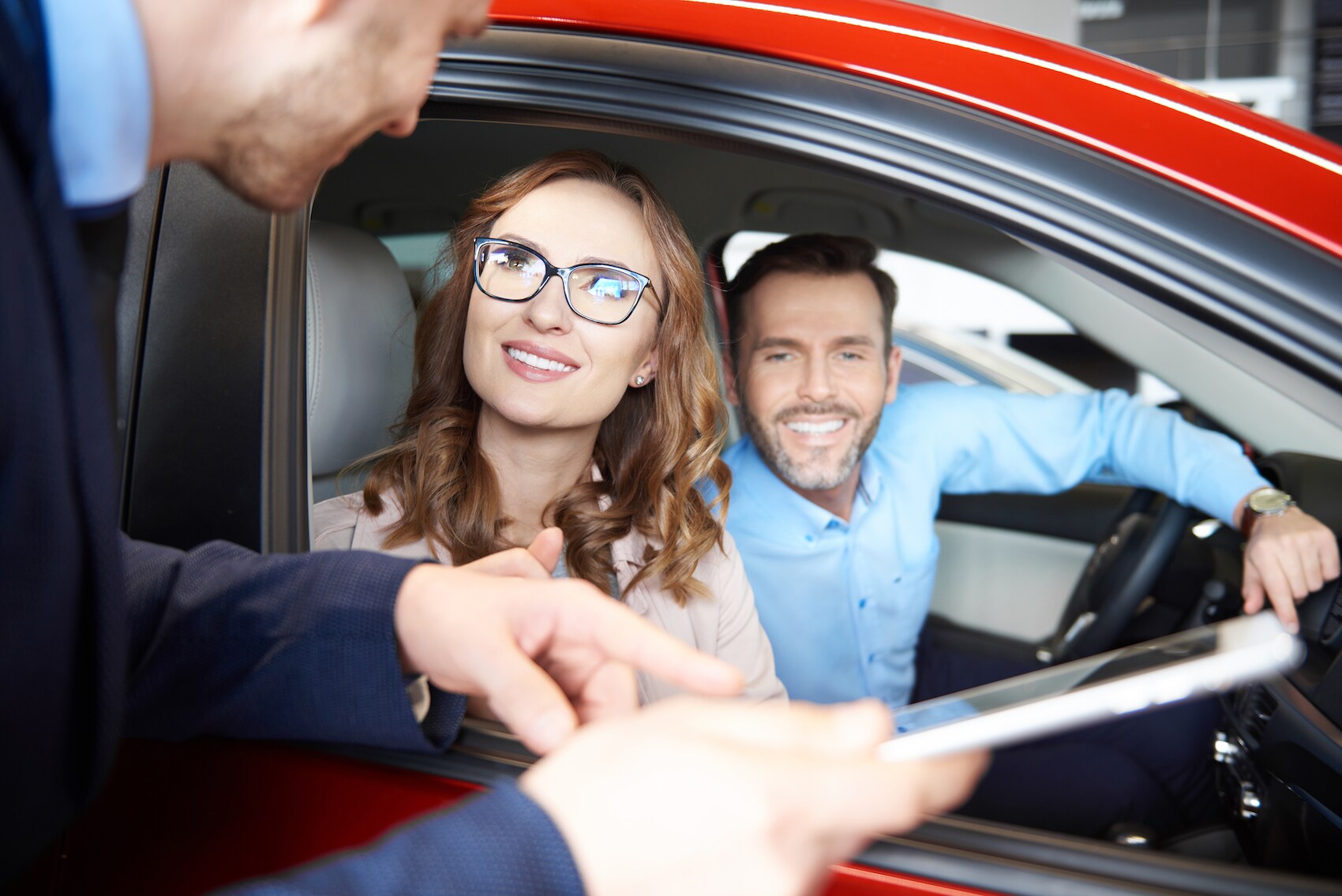 defining APR at Lincoln of New Bern in New Bern | Sales agent explain information to couple at a dealership