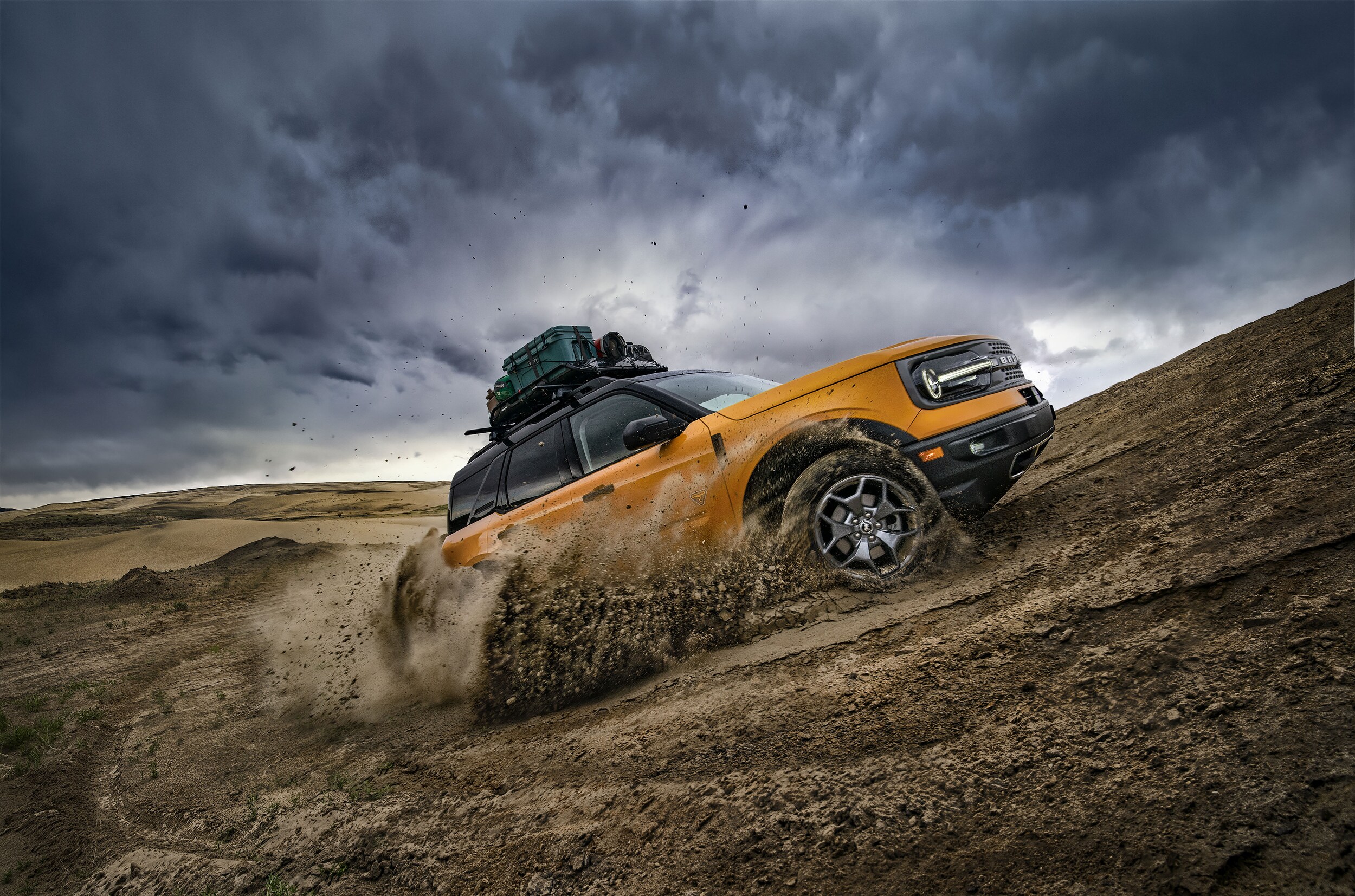 yellow Ford Bronco Sport heading up a steep hill