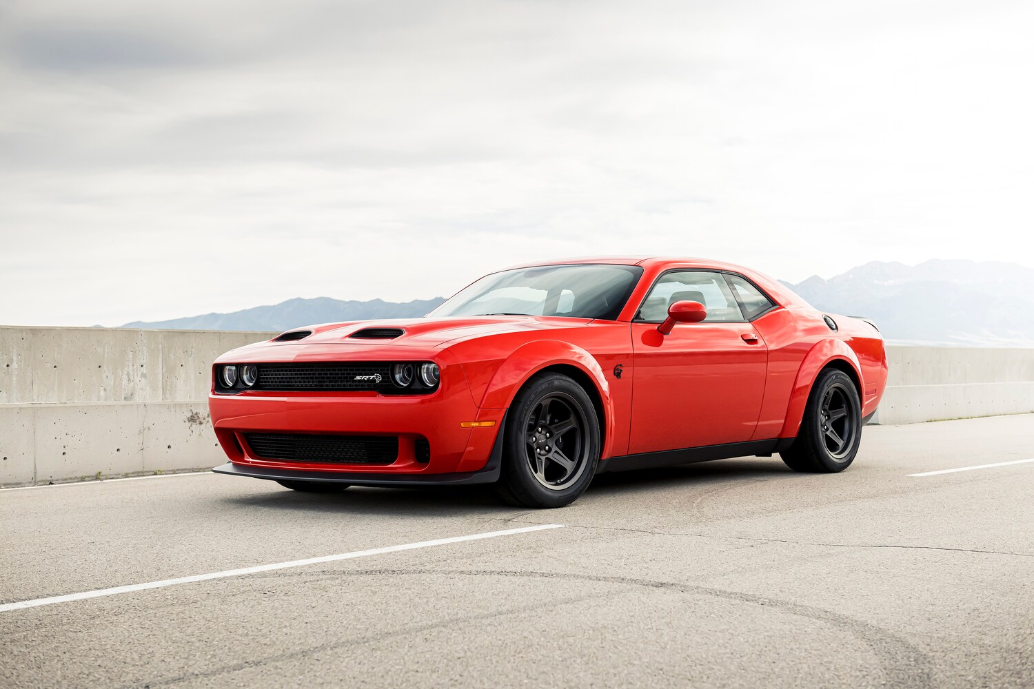 2021-Dodge-Challenger-SRTRedEye-Sedan-L03.png red Dodge Challenger parked on a race track