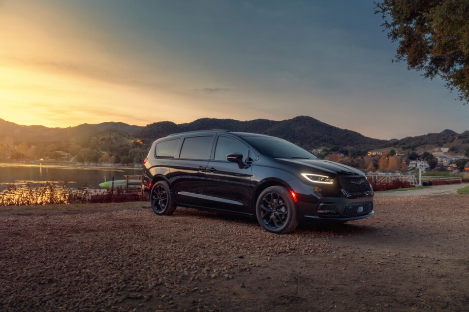 2021-Chrysler-Pacifica-LimitedS-Van-L01 (2).png black Chrysler Pacifica van parked next to a lake, in front of a sunset