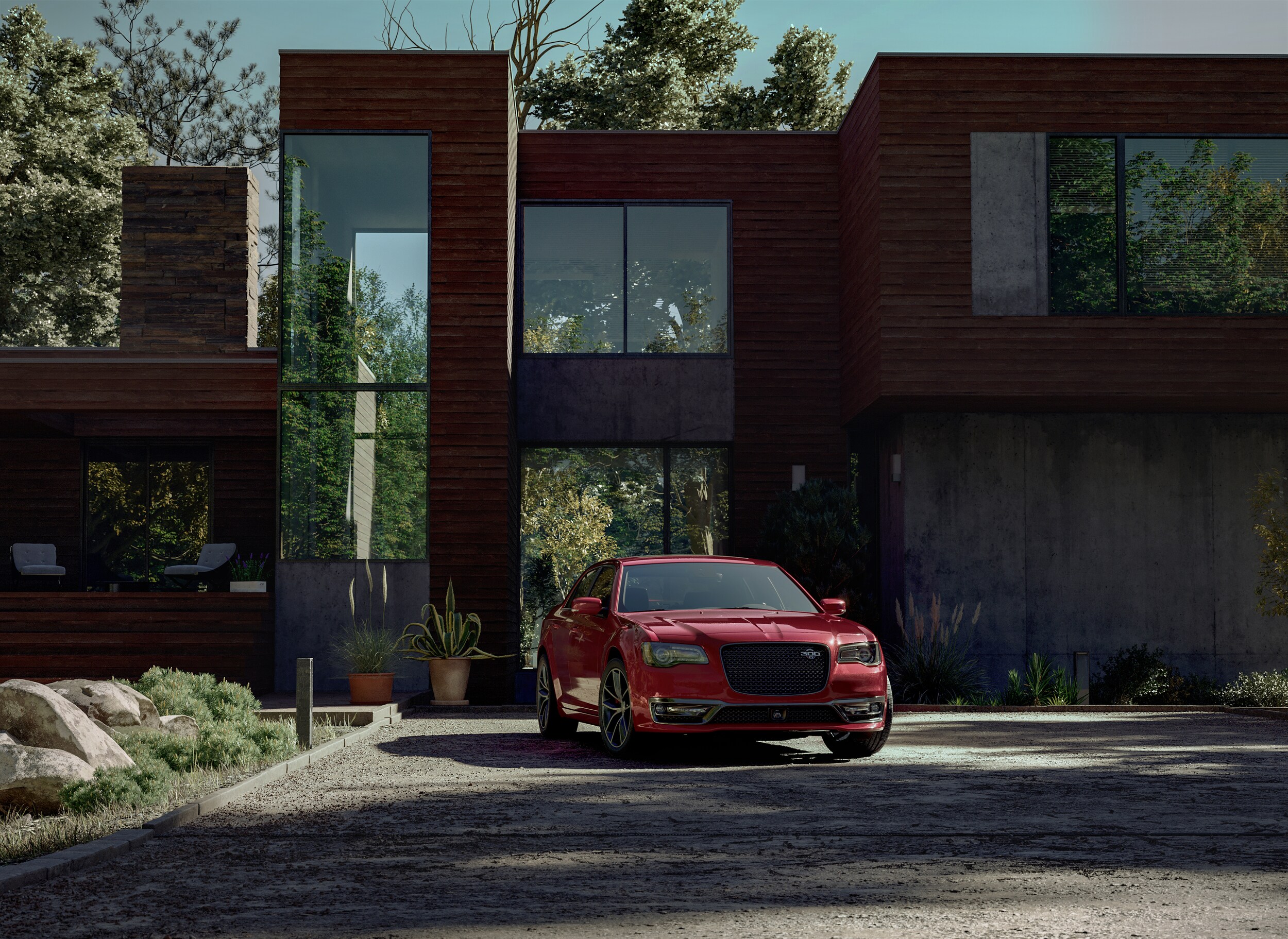 2023-Chrysler-300-C-Sedan-L01 (1).jpg red Chrysler 300 car parked in front of a modern garage