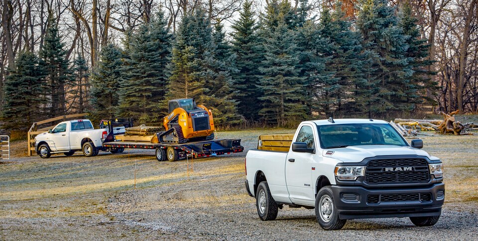 2021-RAM-2500-Tradesman-RegularCab-Truck-L03 (2).png Ram 2500 commercial-grade truck parked next to a logging operation