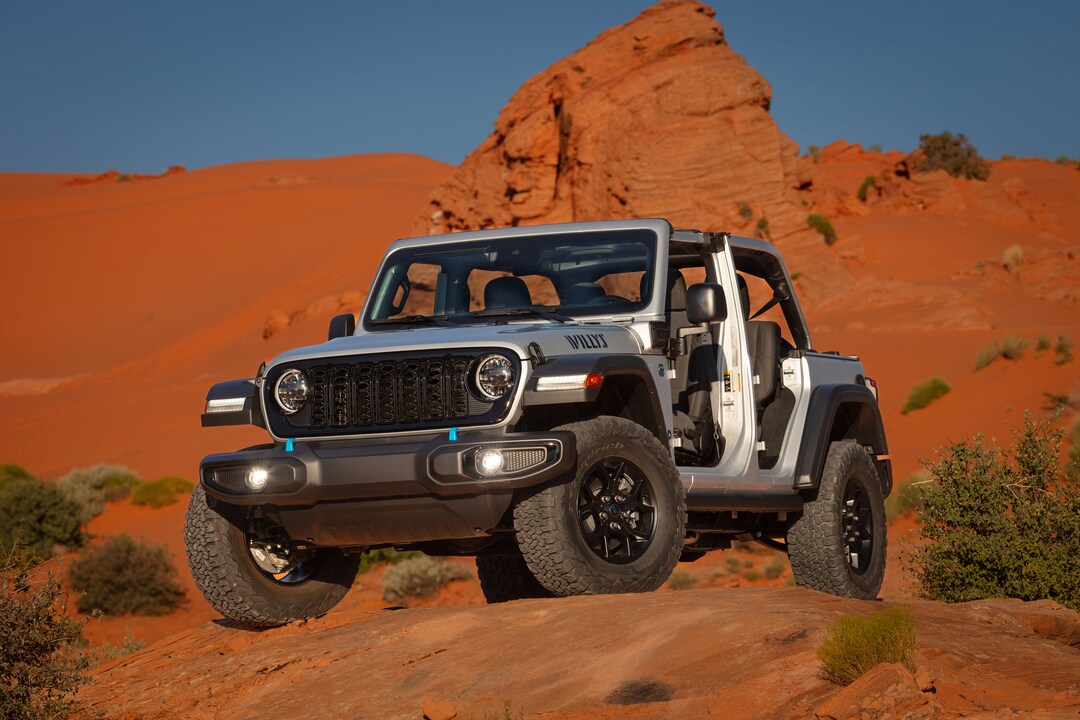 New Jeep Wrangler grey Jeep Wrangler parked in the desert with the doors and roof removed