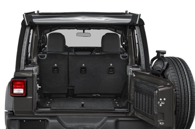 2025-Jeep-Wrangler-interior.png Jeep Wrangler black cargo area with swing out door