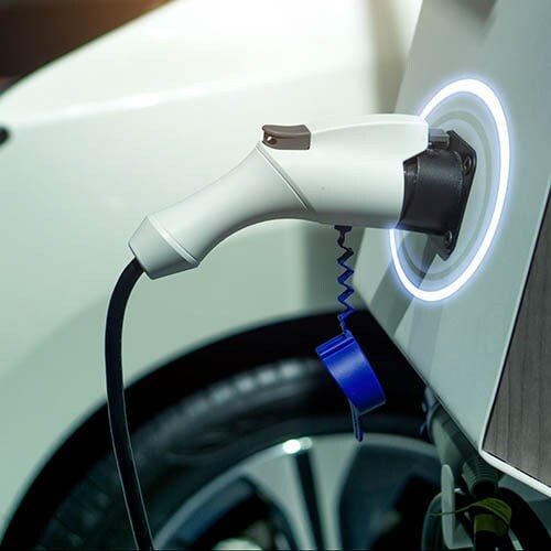 Electric Vehicle Charging - Lithia Chevrolet GMC of Helena An Electric Vehicle plugged in to a charging station.