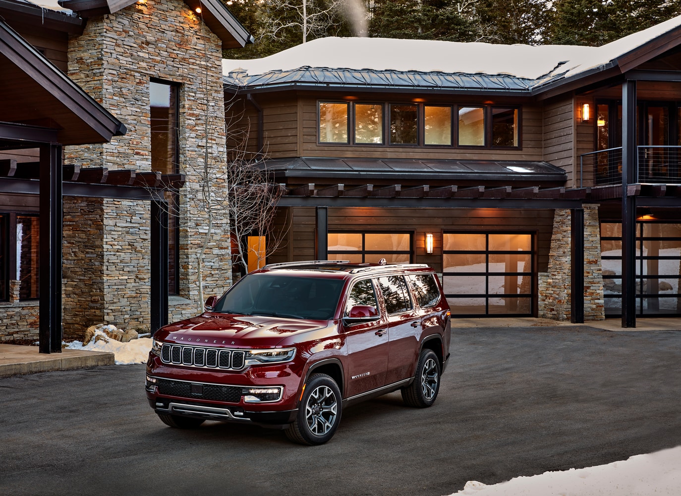 2022-Jeep-Wagoneer-SeriesII-SUV-L16.png red Wagoneer SUV parked in front of a lodge with snow on the roof