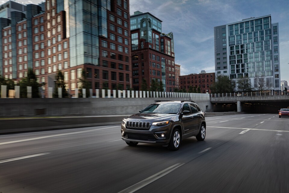 2022-Jeep-Cherokee-Limited-SUV-L01.jpeg black Jeep Cherokee coming out from a tunnel underpass