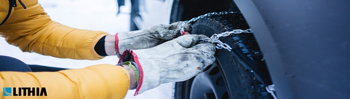 How to install tire chains man installing tire chains in the winter