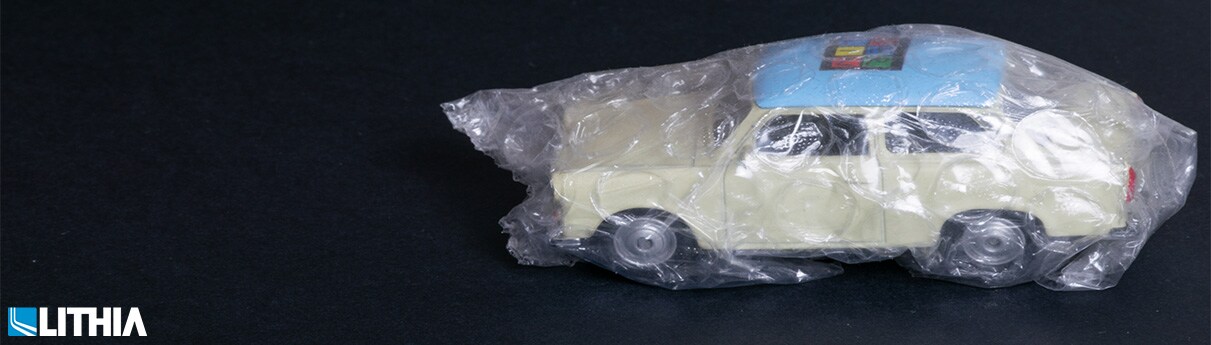 What Auto Insurance Fraud Cost You Toy car wrapped in bubble wrap