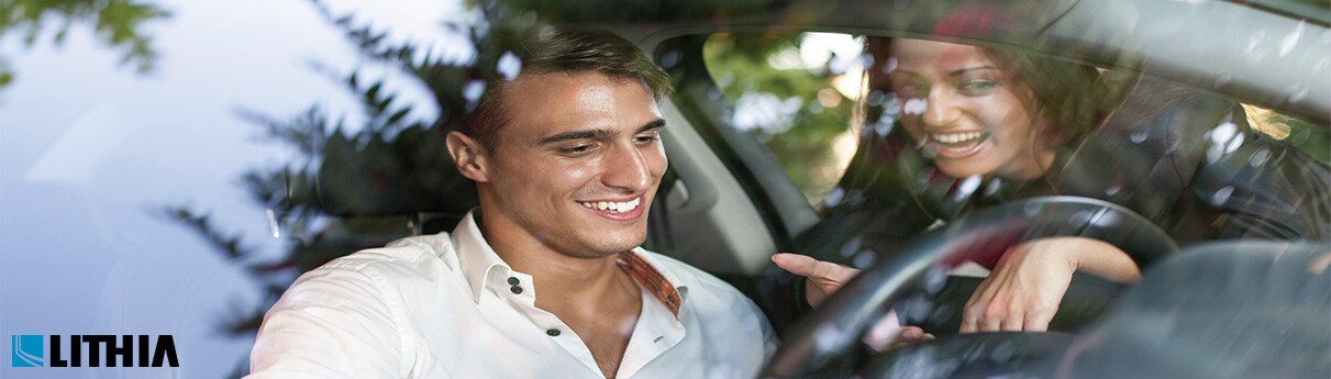 Is Buying Used Better Than Leasing man sitting in the driver seat about to buy a car
