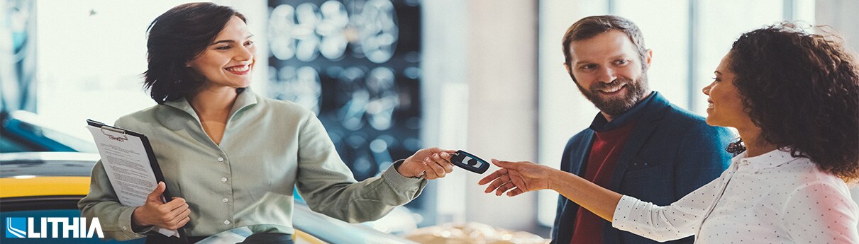 Car Leasing Mistakes to Avoid Sales woman handing over keys to customer