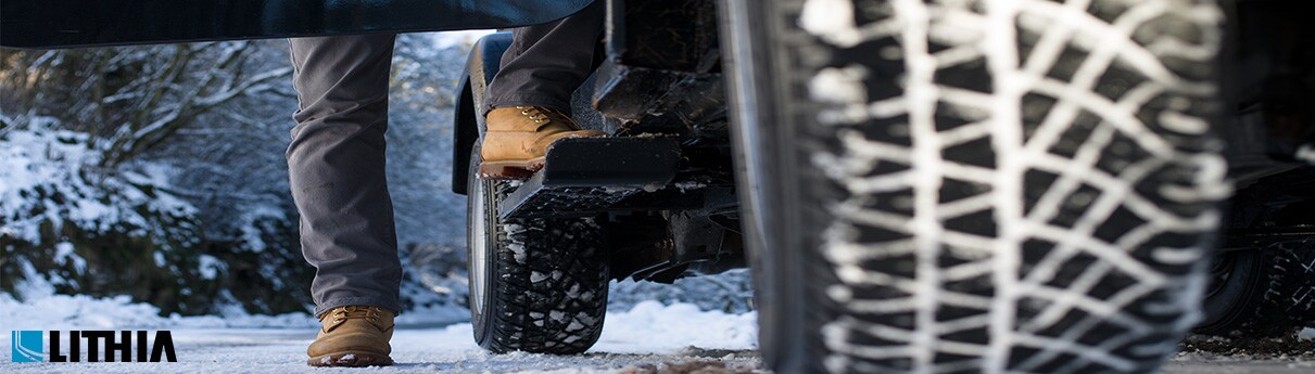 Best AWD Crossovers for Winter Driving Guy getting into a Jeep in the winter