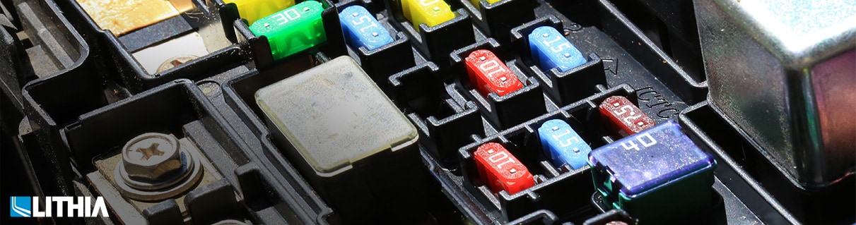 How to Inspect and Replace Auto Fuses frame of an electrical fuse and relay box in a car
