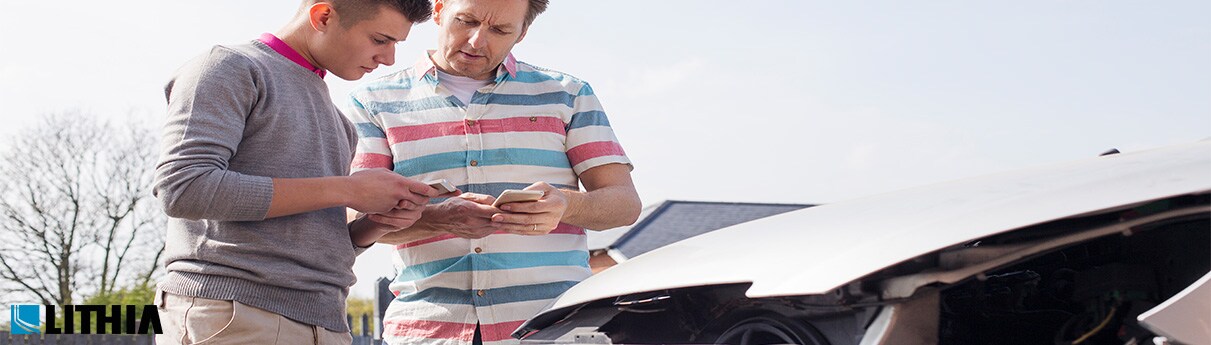 How Car Insurance Accident Claims Work Two men checking documents on a accident