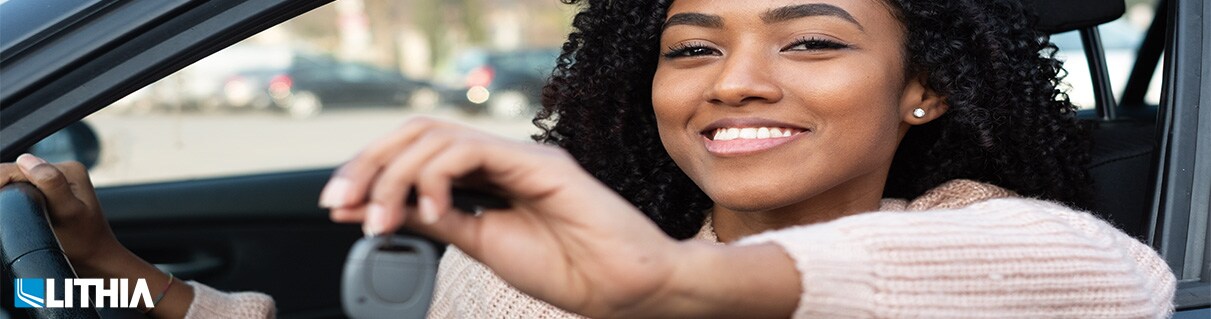 5 Tips to Leasing a Car Woman in car showing new keys to car
