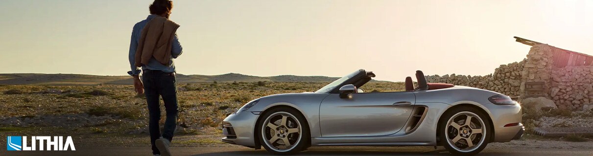 Porsche 718 Boxter Man walking to his Porsche 718 Boxter in the desert