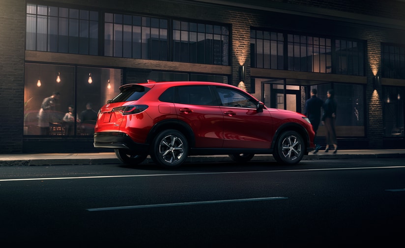 2023-Honda-HRV-EXL-SUV-L03.png red Honda HR-V SUV parked in a city